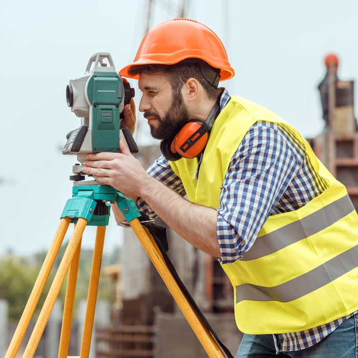 Workman planninkg works on a building site